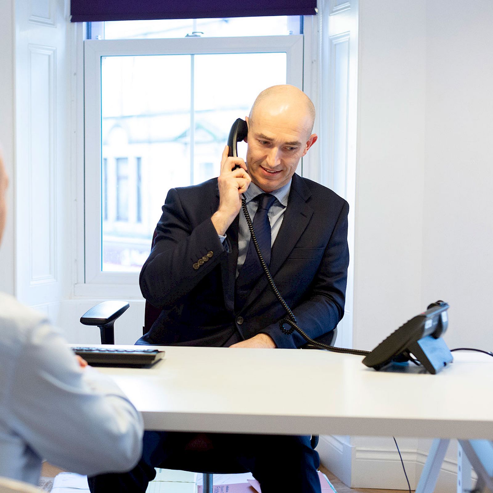 Austin Lafferty employee taking a phone call