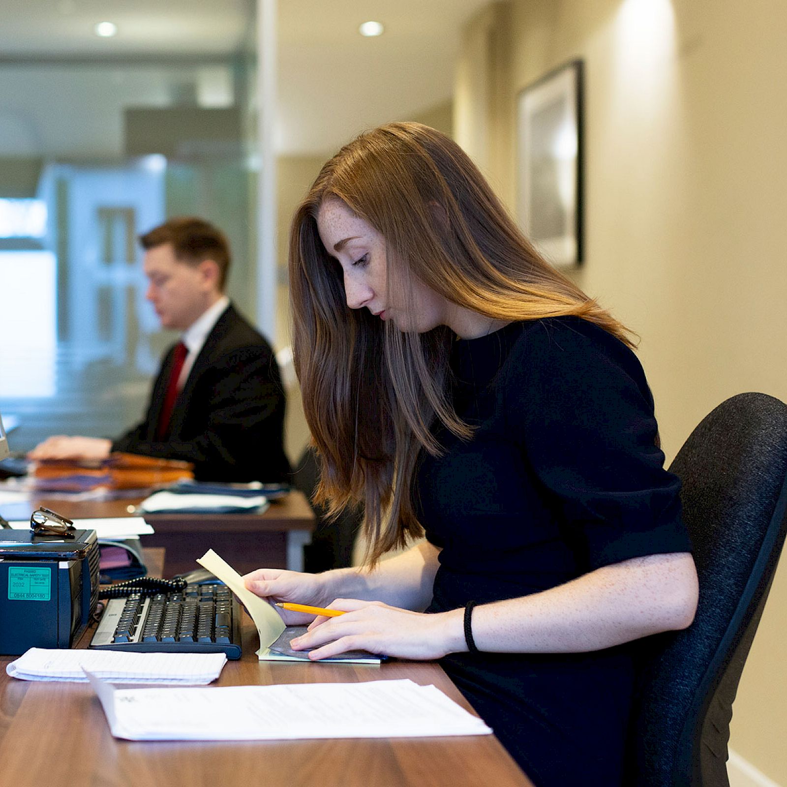 Austin Lafferty employee working at her desk