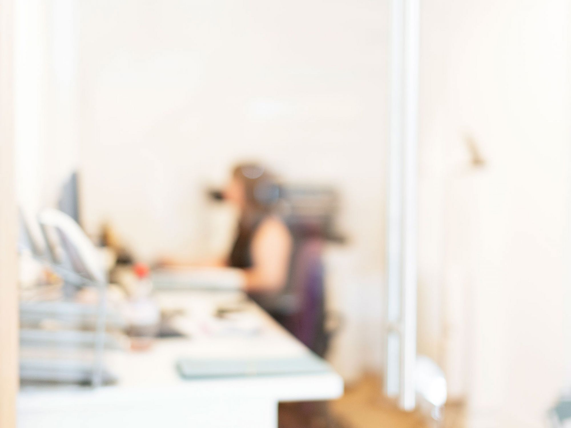 Out of focus shot of Austin Lafferty employees working from the Hamilton branch